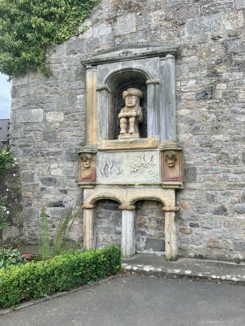 The Ceres Provost statue set into a historic stone wall in the village of Ceres, near Craighall Steading B&B.